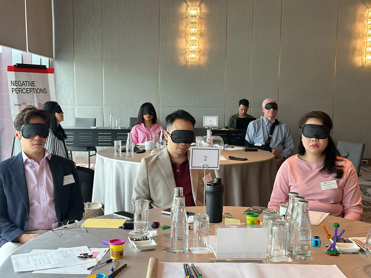 A leadership team wearing blindfolds during the perception exercise